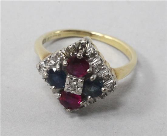 An 18ct diamond and gem set ring, size N.